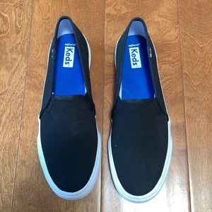 Black slip-on Keds
